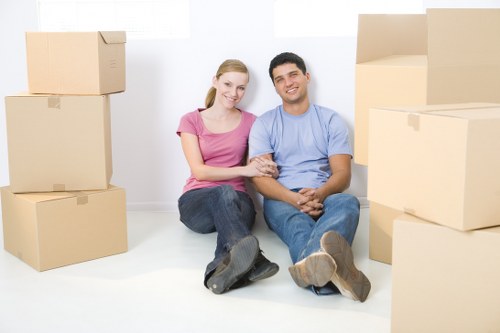 Professional movers handling furniture in a Belgravia flat