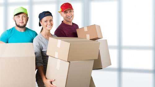 Furniture removal team loading items for pick-up in Belgravia