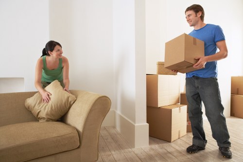 Staff using proper lifting techniques during a house move