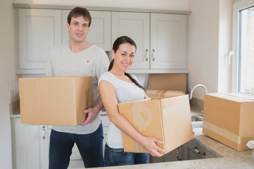Professional movers packing fragile items for a Belgravia relocation